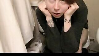 Tattooed brunette girl pushing shit