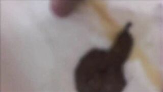 Girl shitting a big quantity of poo