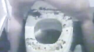 Splashing shit on her toilet seat