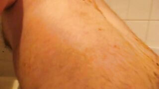 Man lets piss and shit run down his body in the shower
