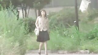 Japanese girl shitting by the bus stand
