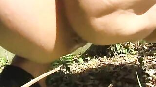 Two lovely girls poop in the grass