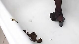 Hot gal shits in empty bathtub