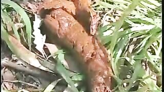 Young girl poops hard in the Jungle