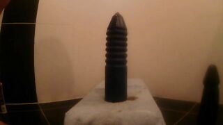 Girl spreads her ass cheeks while sitting on the toilet