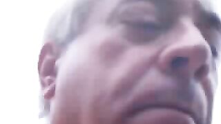 Woman eats a pile of shit outdoors