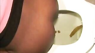 Slutty ebony lady dropping shit in the toilet