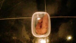 Lovely amateur lady dropping shit in the container
