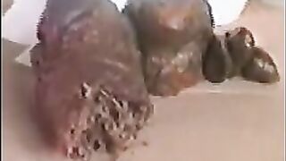 Curvy blonde MILF shitting at home