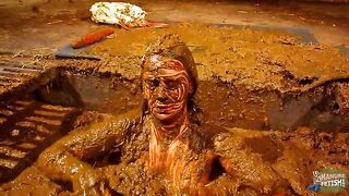 Betty has fun in the manure channel - bathing in the cowshit