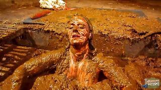 Betty has fun in the manure channel - bathing in the cowshit