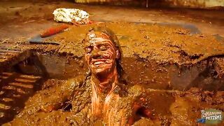Betty has fun in the manure channel - bathing in the cowshit