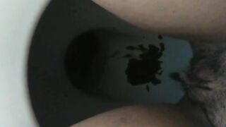 Messy dark shit in the toilet