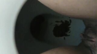 Messy dark shit in the toilet