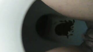 Messy dark shit in the toilet