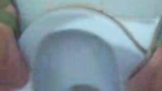 Woman fucks herself with a huge anal dildo