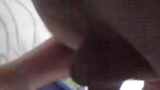 Woman fucks herself with a huge anal dildo