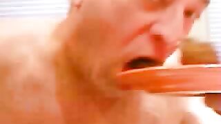 Old man eats a big plate of shit