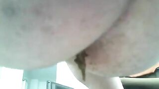 Girl takes a piss in the driver's seat of a car