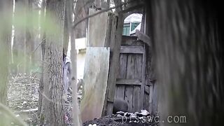 Girls shit and piss behind a building