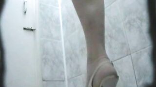 Girl plays with string dangling from her ass