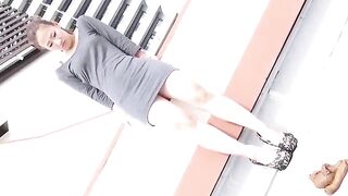 Asian woman shits on a building roof