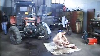 Girl covered in shit while man spreads the shit with his hands