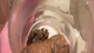 Girl flicks a big turd off the toilet seat