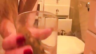 Girl flicks a big turd off the toilet seat