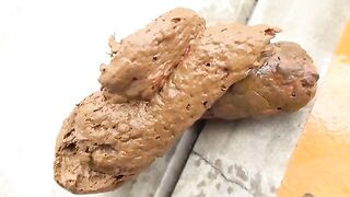 Girl takes a huge shit on a red couch and spreads it with her fingers