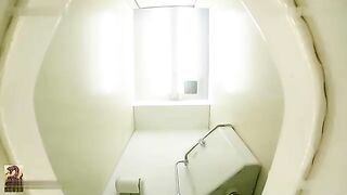 Asian girl takes a massive shit on a toilet