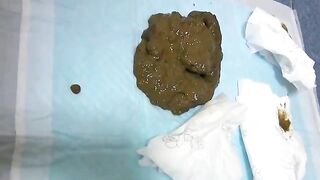Woman pulls out a huge steaming pile of shit