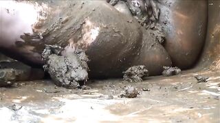 Two girls squish shit with their bare asses on the floor