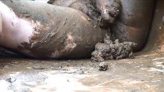 Two girls squish shit with their bare asses on the floor