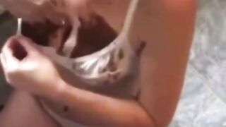 Woman eats her own shit in front of the toilet
