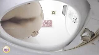 Girl squats and takes a huge shit in the toilet