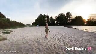 Slut takes a shit on the beach with a cow in the background