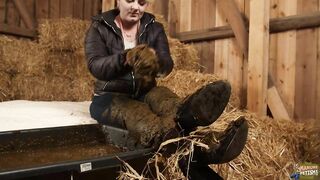 Woman gets into trough filled with shit