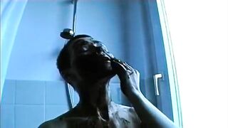 Woman eats piss in the shower with a partner