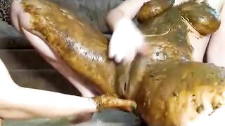Woman takes a massive shit while someone rubs it on her