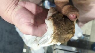 Girl holds a huge blob of shit in her hand
