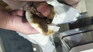 Girl holds a huge blob of shit in her hand
