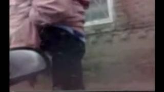 Granny pooping outdoor