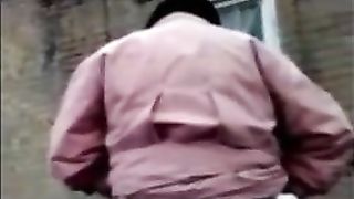 Granny pooping outdoor