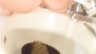 Two girls are pooping in the sink