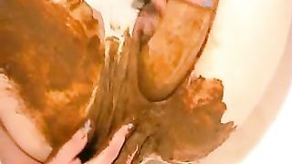 Licking the tip of a shitty dildo