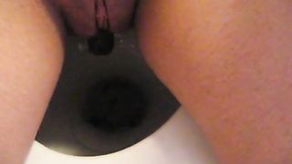 Shaved girl pooping