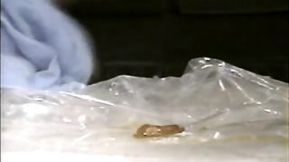 Shit and orange juice in her opened mouth