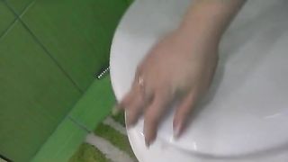 Teen blonde pooping in a potty