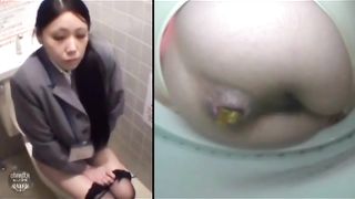 Sexy brunette secretary in public bathroom